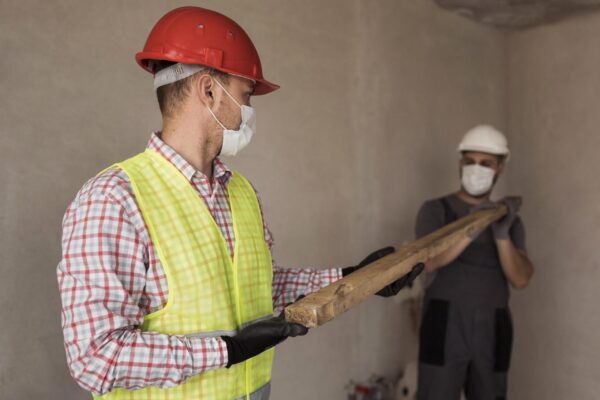 medium-shot-men-working-with-medical-masks