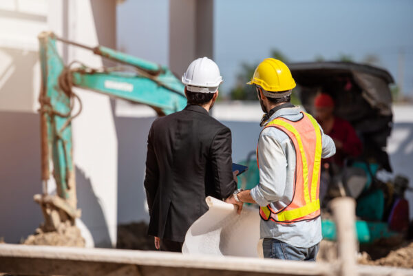 Construction worker and engineer working together on construction site. RPL certification guide